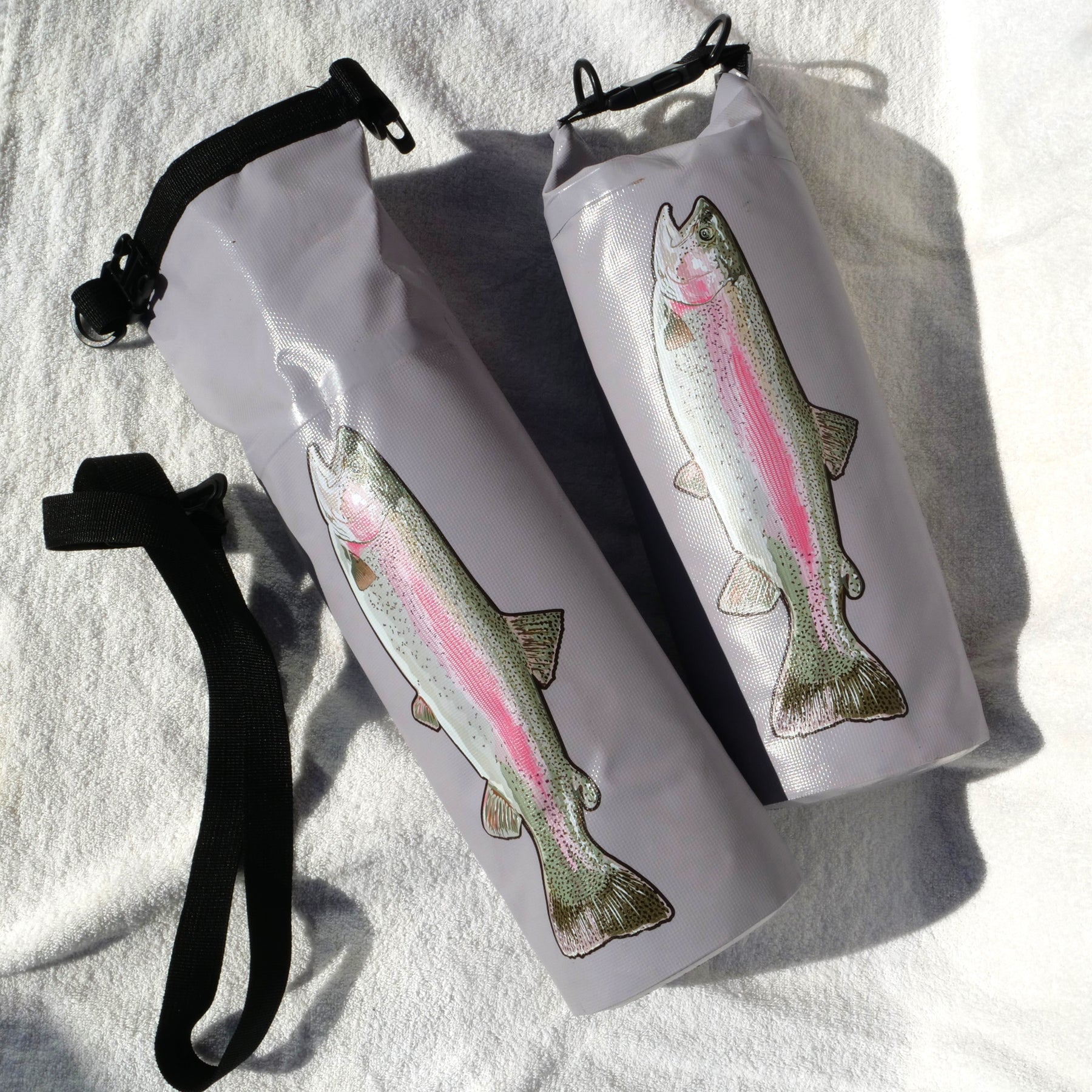 insulated fish cooler with frozen water bottles and trout inside